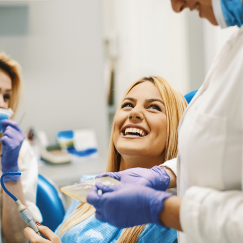 Woman laughing during orthodontic treatment