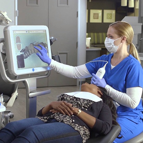 Orthodontic team member using iTero digital imaging system