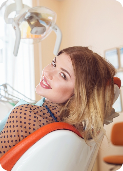 Woman smiling while receiving dental services in Ripon Wisconsin