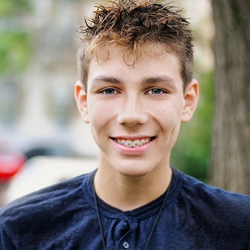 Smiling teen boy with classic braces
